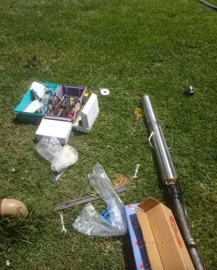 Submersible borehole pump and installation equipment on a lawn